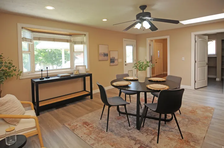 Recessed lighting, bay window, ceiling fan, wood-finish flooring, and pantry with shelving