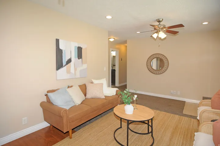 Recessed lighting, ceiling fan light fixture, light neutral wall paint, wood-finish flooring, and carpet flooring