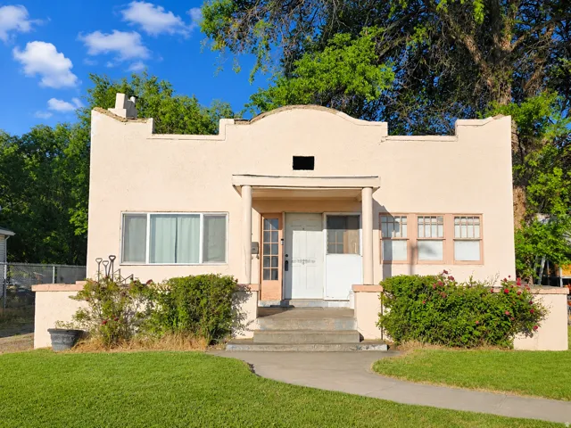 Stucco exterior with a parapet roofline