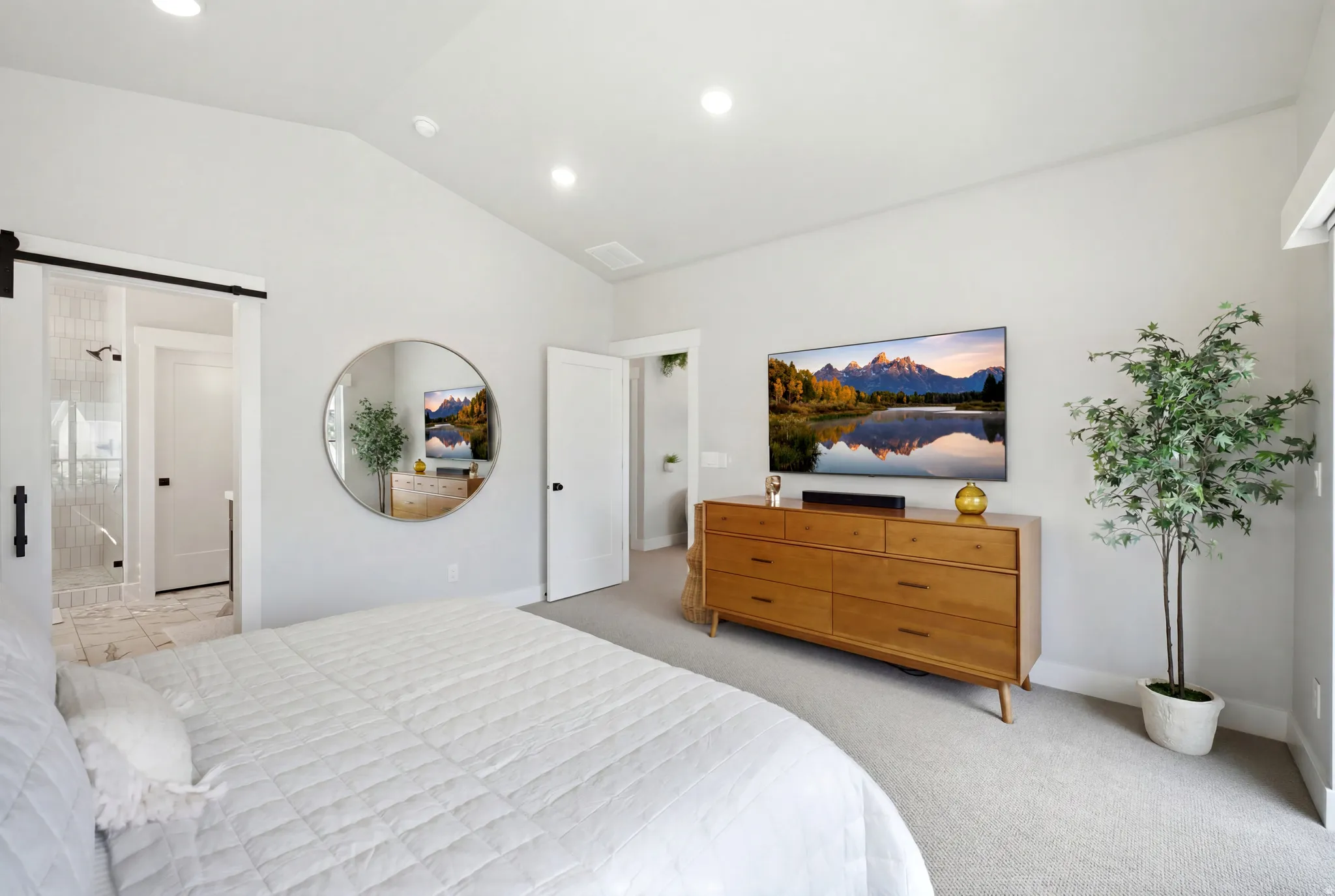 Vaulted ceiling bedroom featuring plush carpeting and recessed lighting