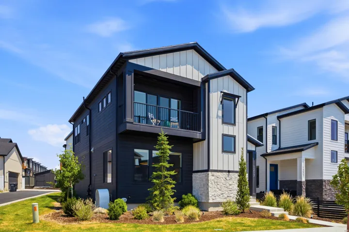 Modern black and white exterior with vertical and horizontal siding