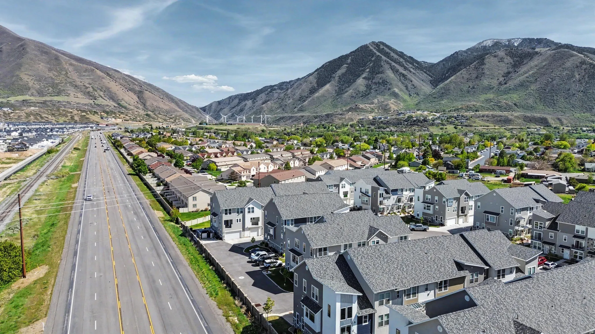 Aerial perspective showcasing a residential development with mountain backdrops