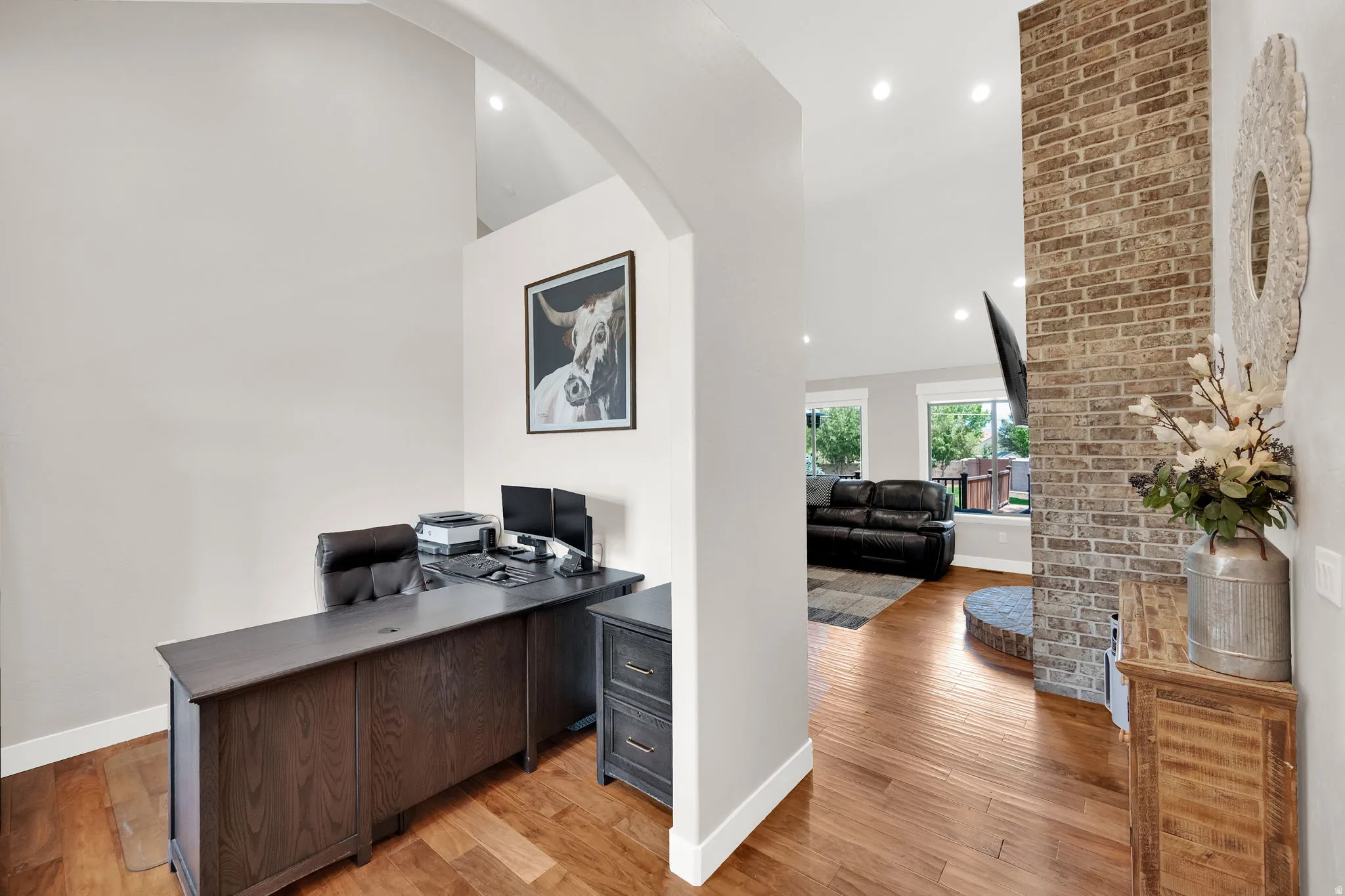 Wood-finish flooring throughout, featuring an open concept design