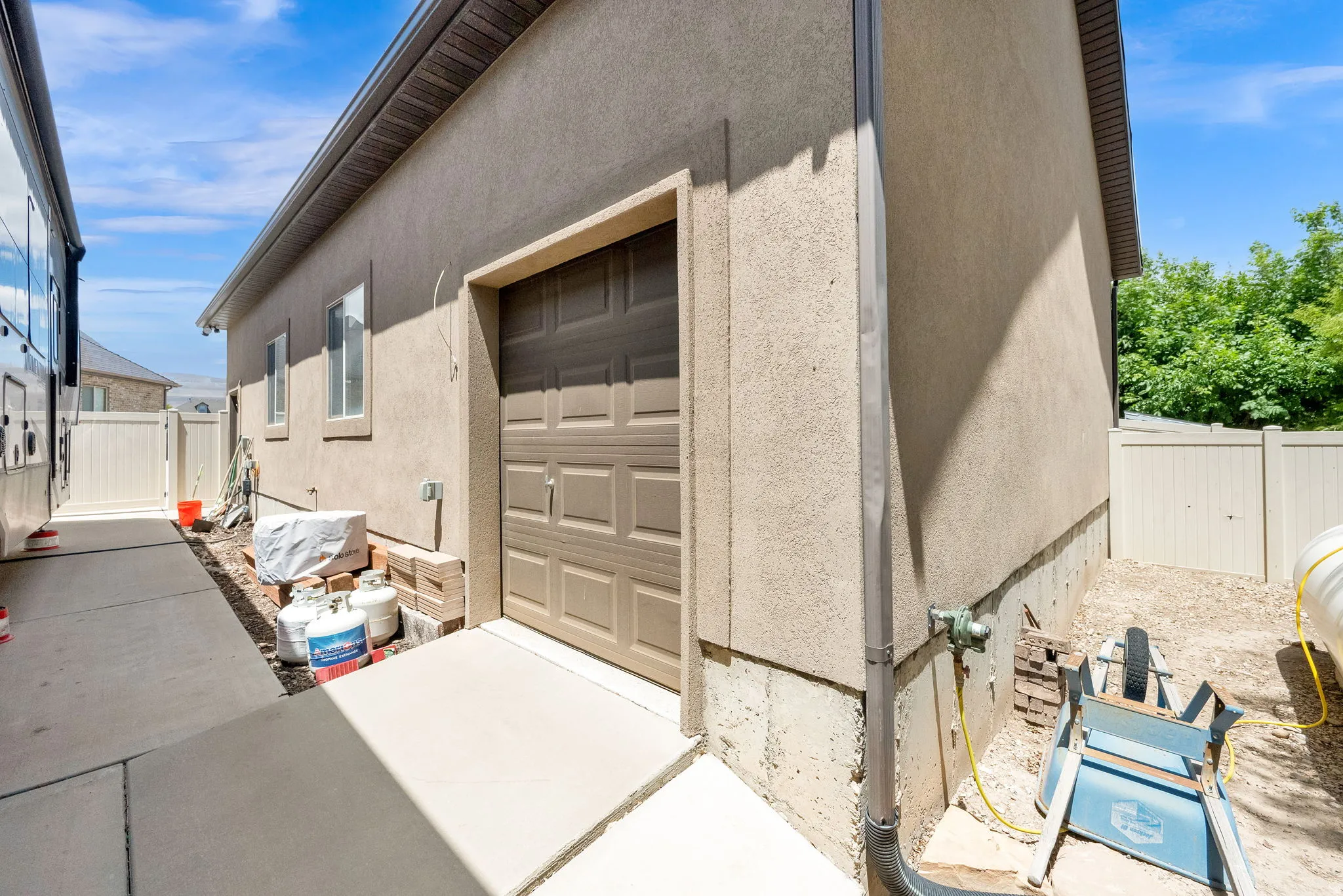 Detached oversized garage feature one of 2 overhead doors.  Great for your riding lawn mower.