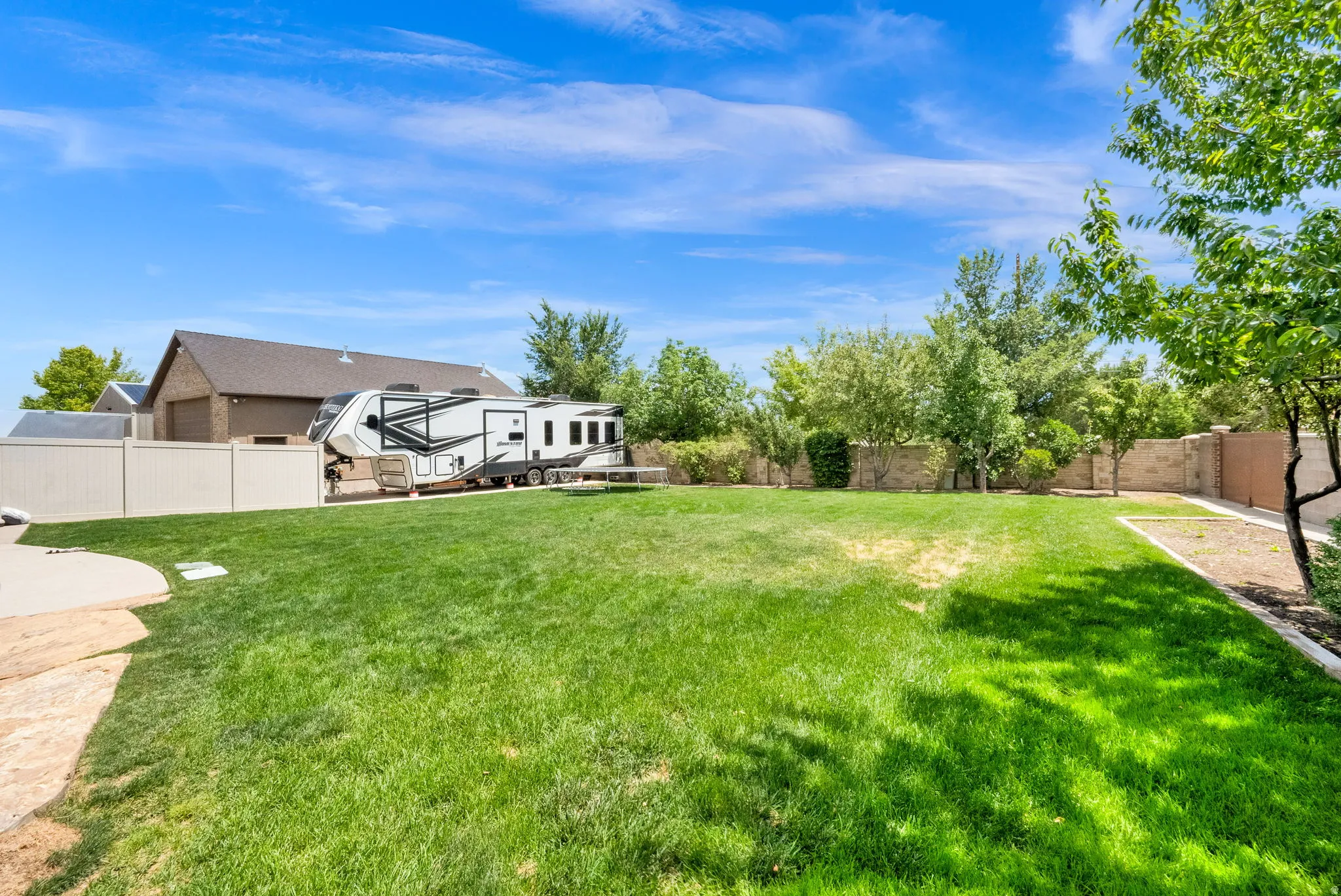 Fenced backyard and RV Pad
