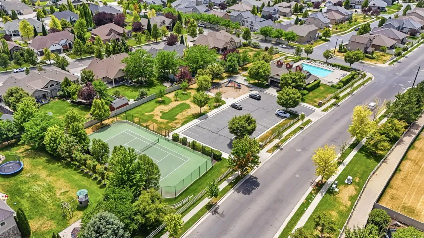 Community recreation area with tennis court, swimming pool, and playground.
