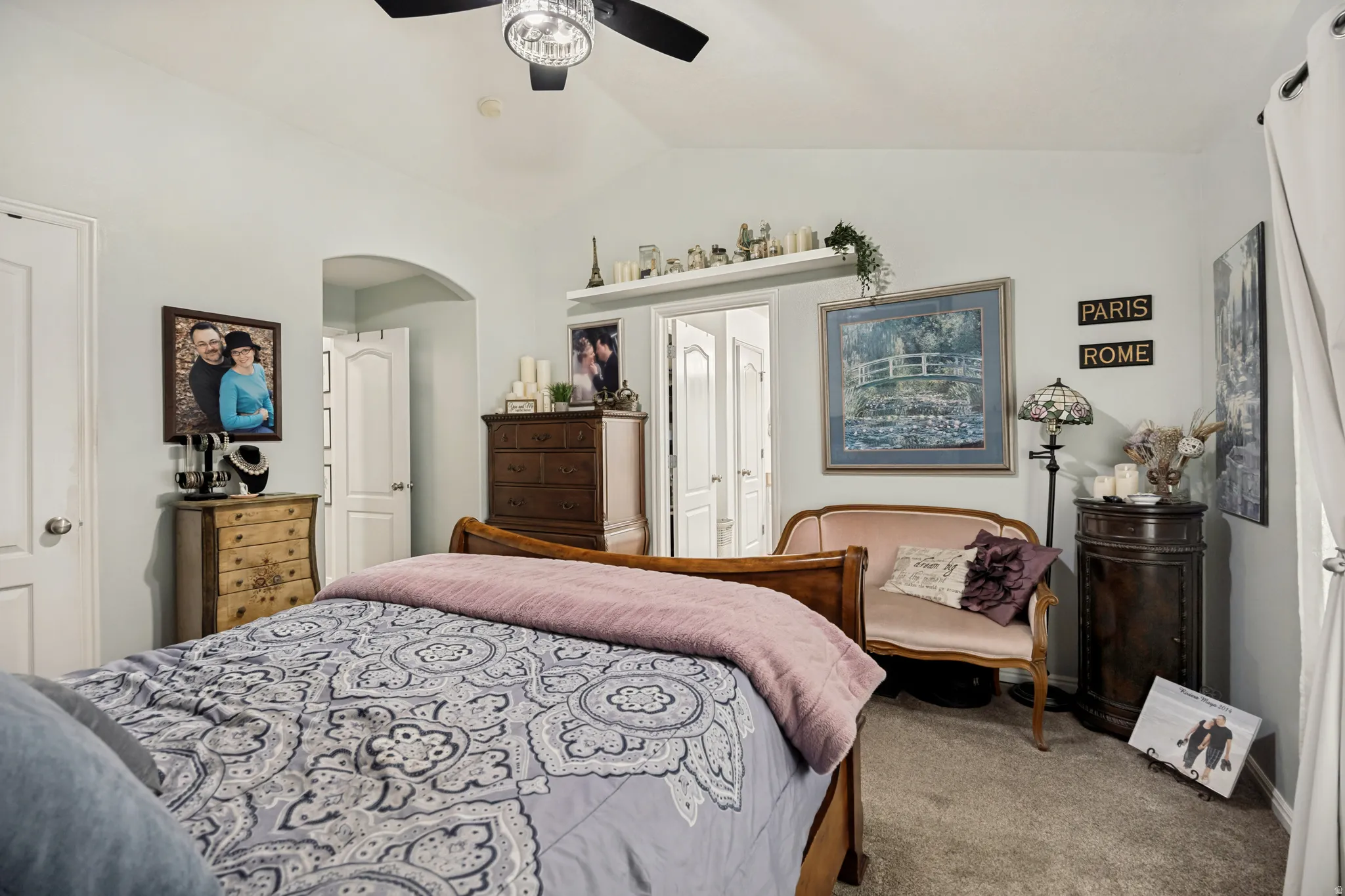 Vaulted ceiling featuring a contemporary ceiling fan