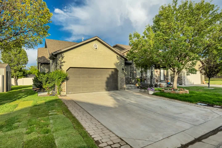 Stucco and stone facade with a two-car garage
