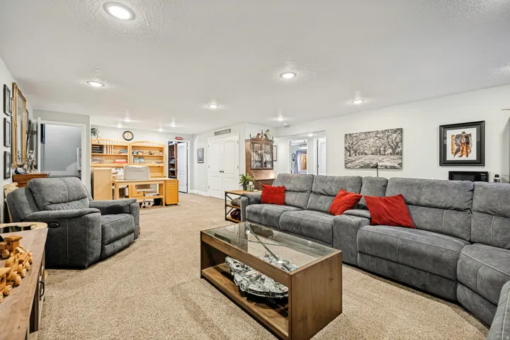 Spacious interior featuring neutral carpeting and recessed lighting throughout