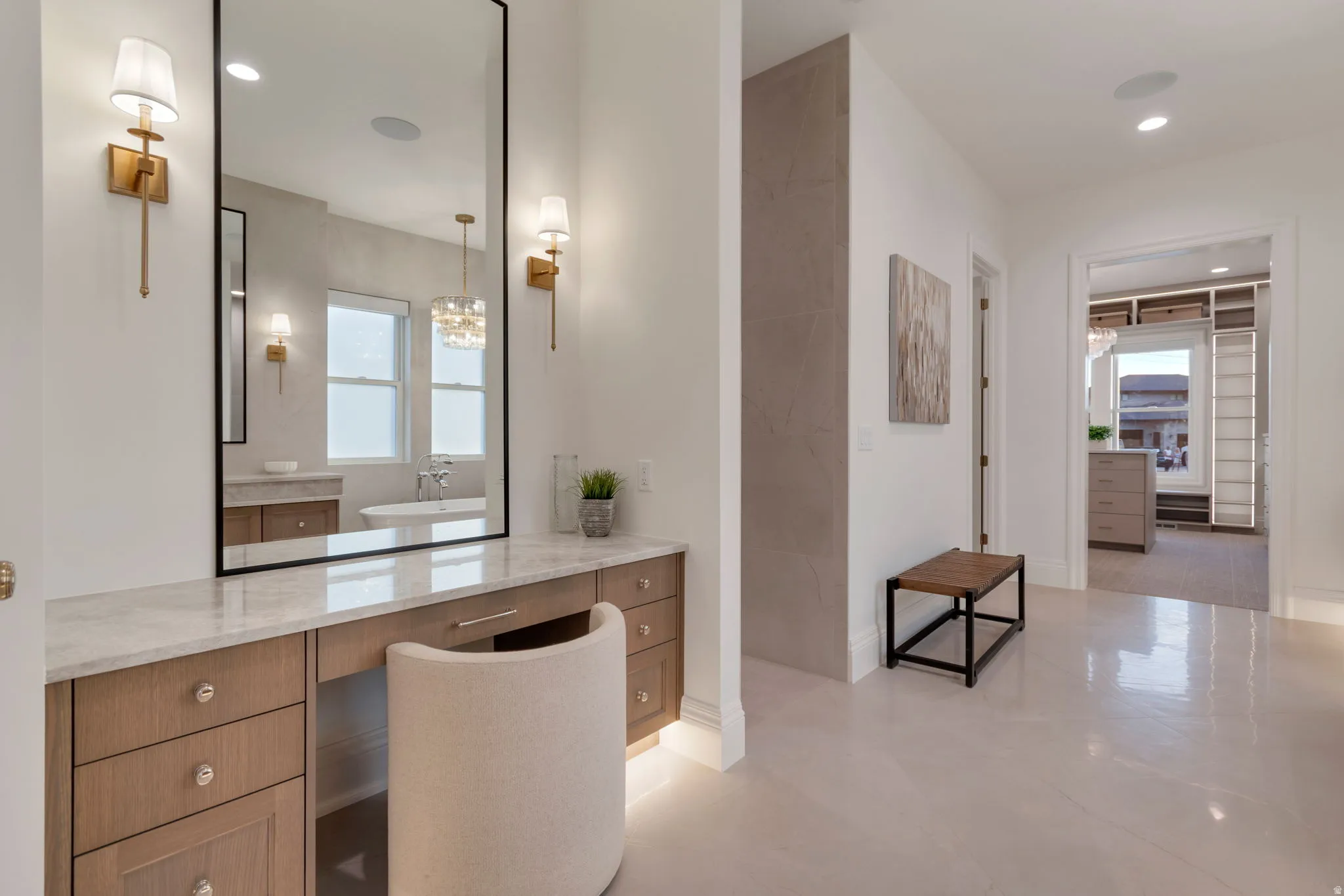 Integrated vanity featuring a stone countertop, built-in cabinetry with crystal-knob hardware