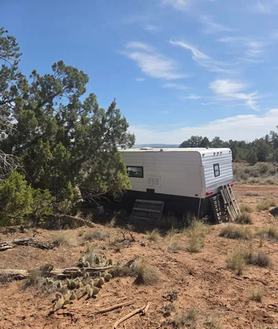 White fix-er-upper travel trailer
