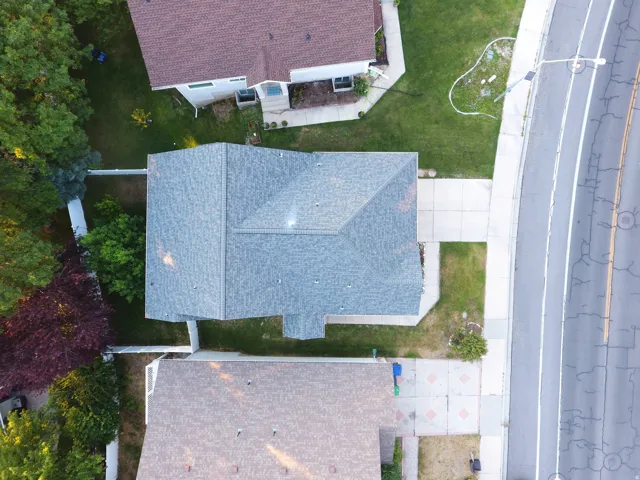 Gable roof property with gray asphalt shingles