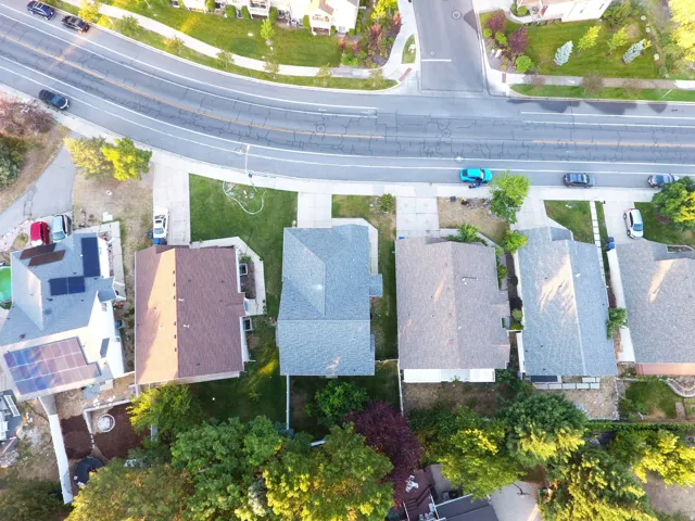 Aerial perspective showcasing a residential street with multiple single-family homes