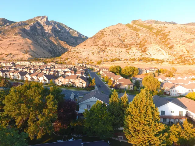 Expansive residential community framed by prominent mountains