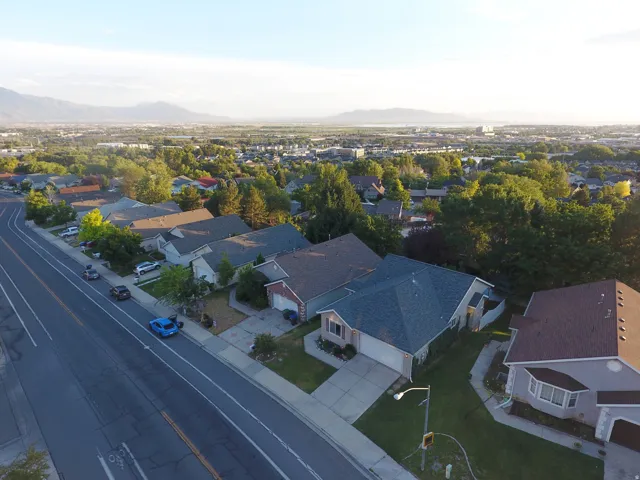Aerial perspective showcasing a residential neighborhood with varied home styles and mature landscaping