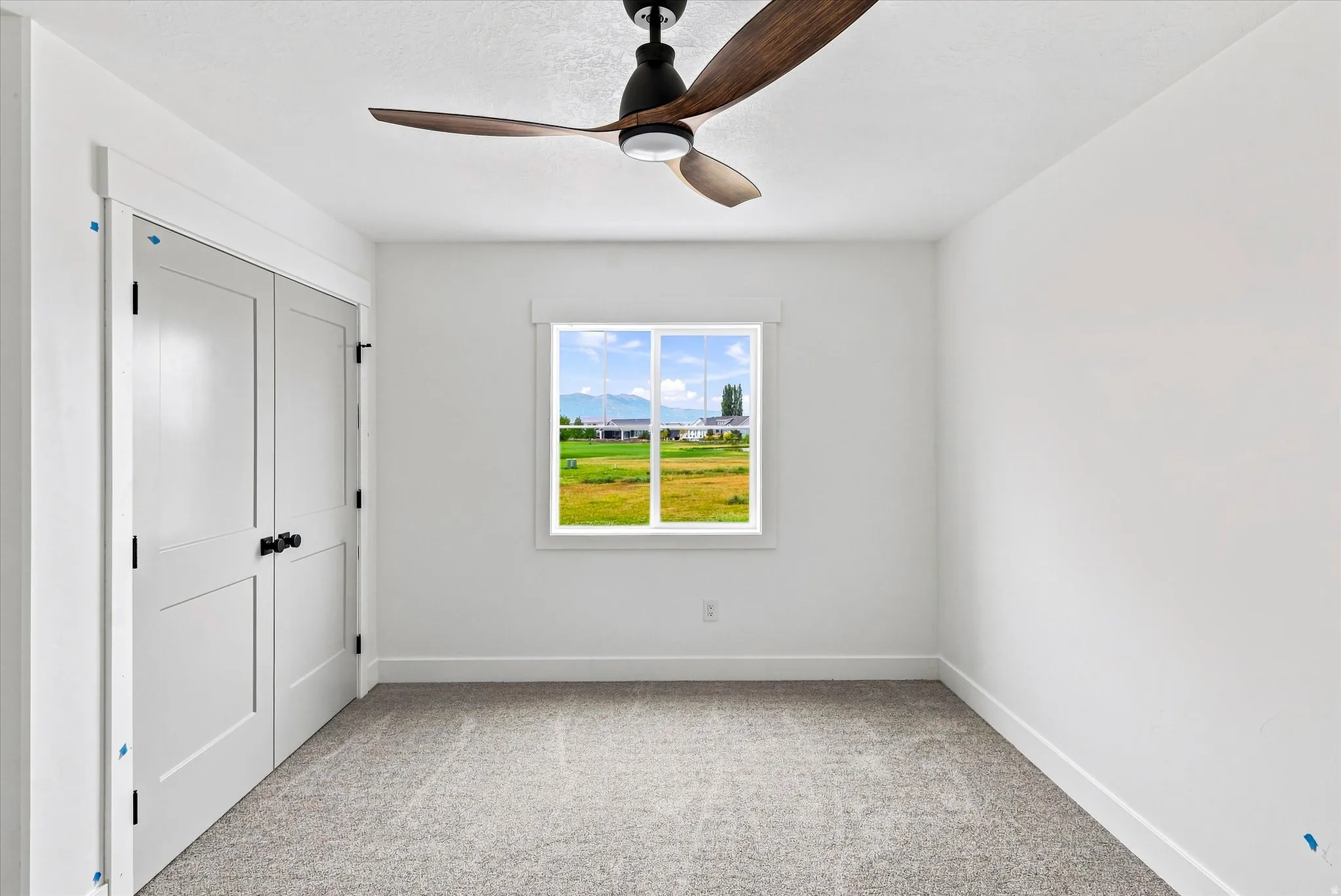 Neutral-toned carpeting paired with white walls