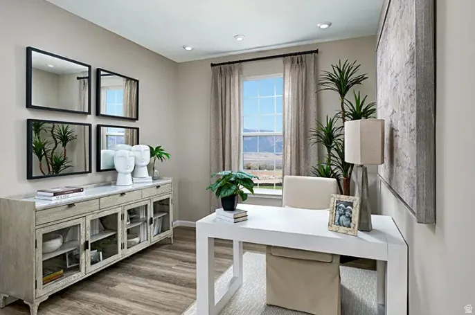 Bright interior room featuring wood-finish flooring and neutral wall tones