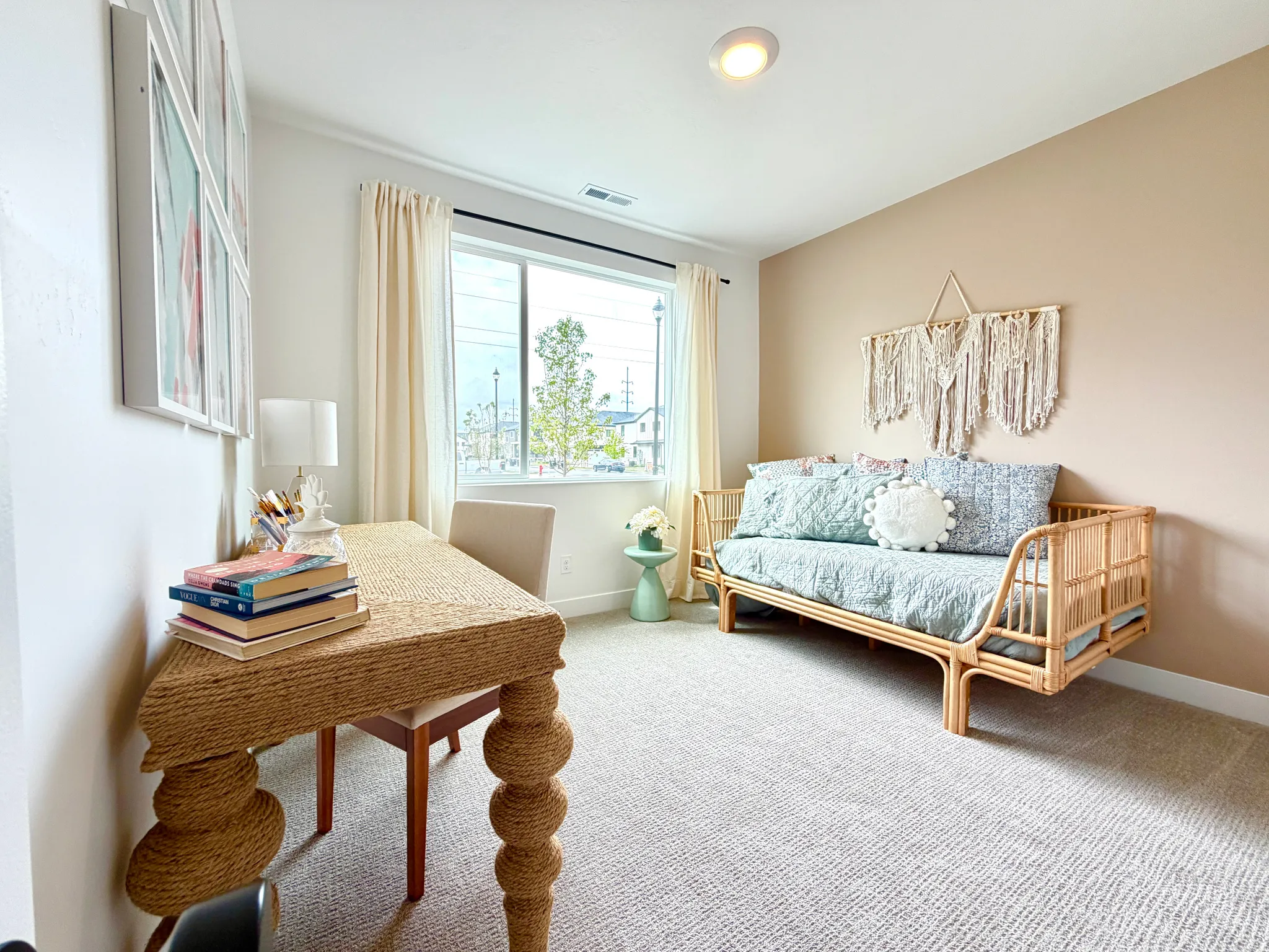 Carpeted room with a large window, recessed ceiling light, and a two-tone wall finish