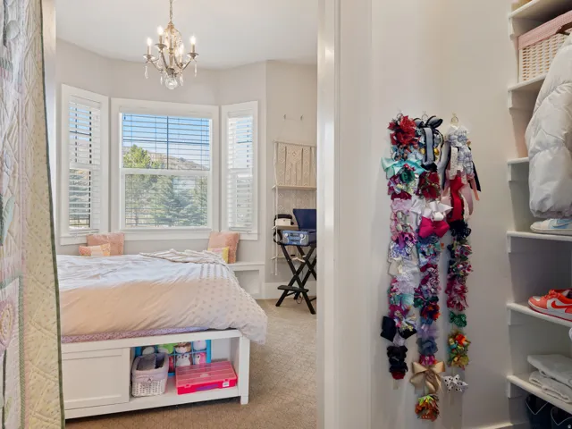 Bay window with built-in bench seating and solid white plantation shutters