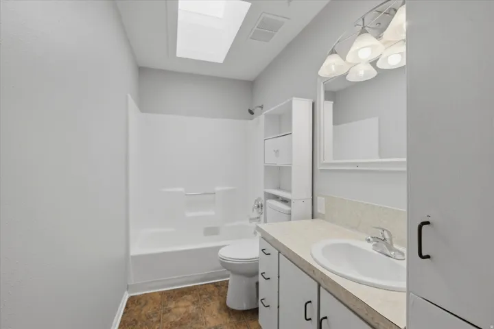 Main bathroom with skylight