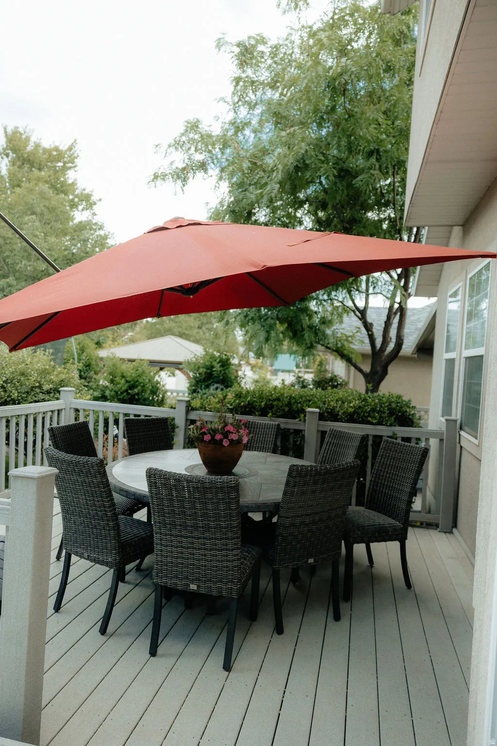 Outdoor deck featuring light-toned decking, a perimeter railing, and visible exterior siding