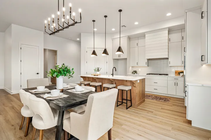 Spacious kitchen and dining area with wood-finish flooring
