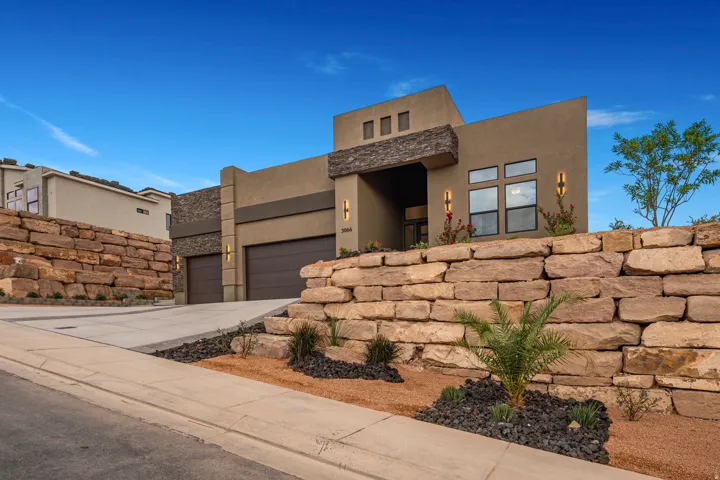 Contemporary stucco exterior with stone accents