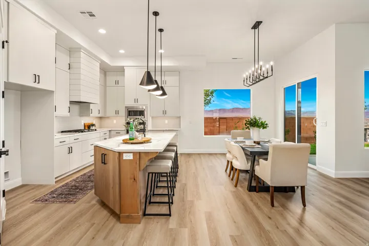 Open-concept living space with wood-finish flooring