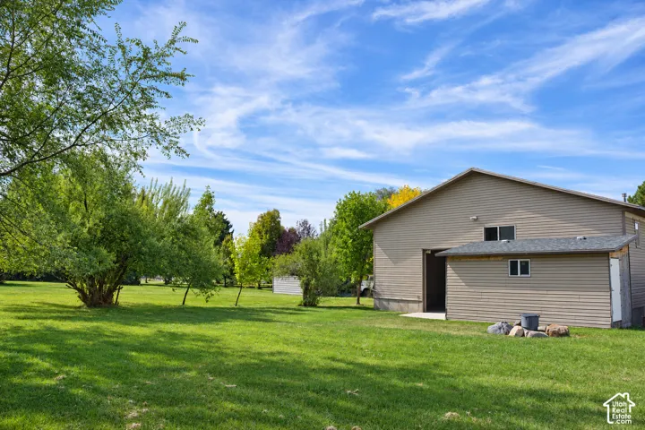 Expansive green lawn with mature trees