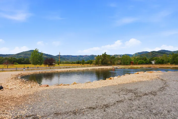 Expansive water feature with a stone and gravel shoreline
