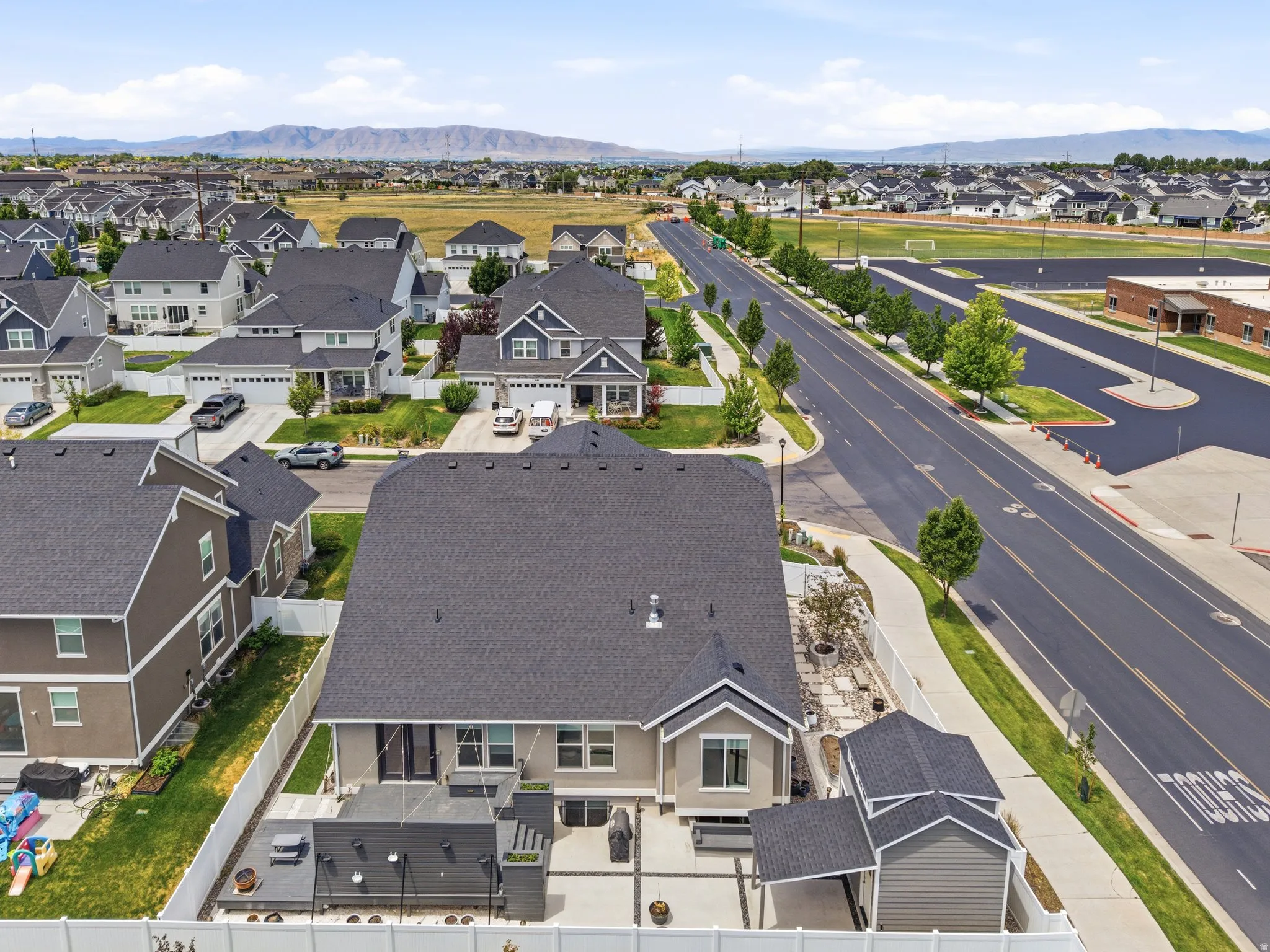 Aerial perspective showcasing a residential community with distant mountains