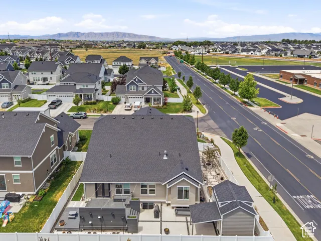 Aerial perspective showcasing a residential community with distant mountains