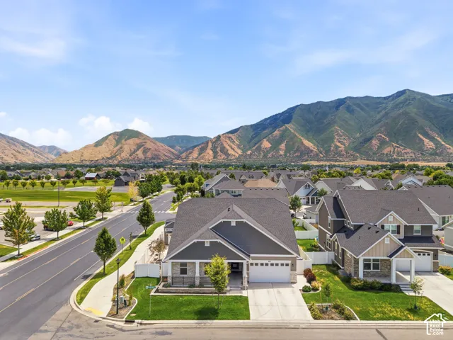 Contemporary ranch-style residence featuring a prominent front-facing garage