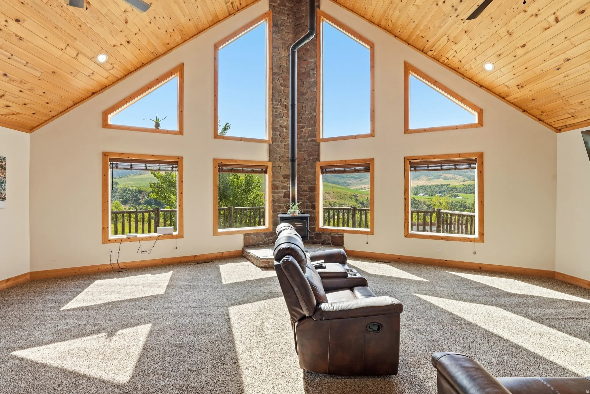 Vaulted wood-paneled ceilings with recessed lighting