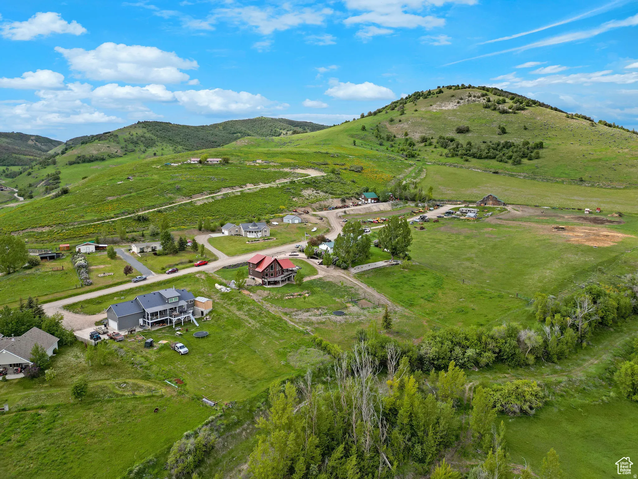 Expansive green landscape with rolling hills and distant mountains