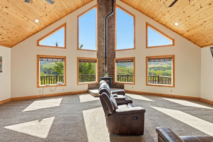 Vaulted wood-paneled ceilings with recessed lighting