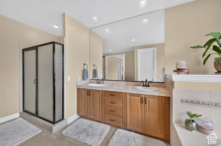 Dual vanity with wood-finish cabinetry and light-toned countertops