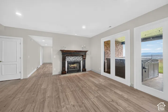 Spacious interior with wood-finish flooring and recessed lighting