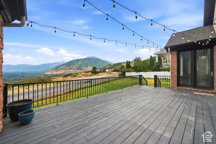 Expansive outdoor deck featuring mountain and city scenery