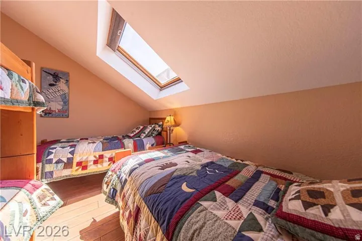 Sloped ceiling interior space featuring a skylight