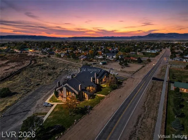 Contemporary multi-unit property featuring a dark-toned exterior and multiple chimneys