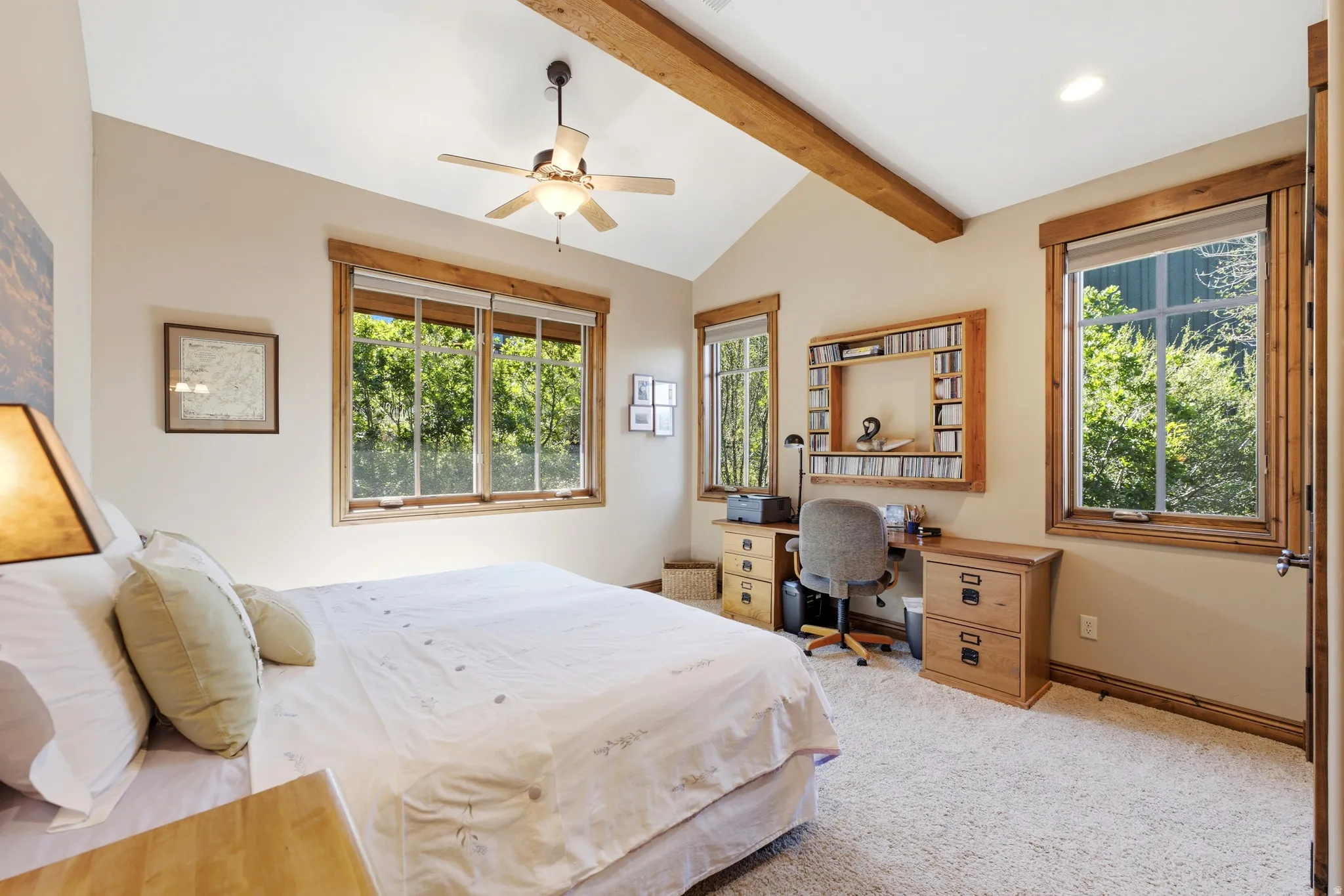 Vaulted ceiling with exposed wood beams, ceiling fan, and recessed lighting
