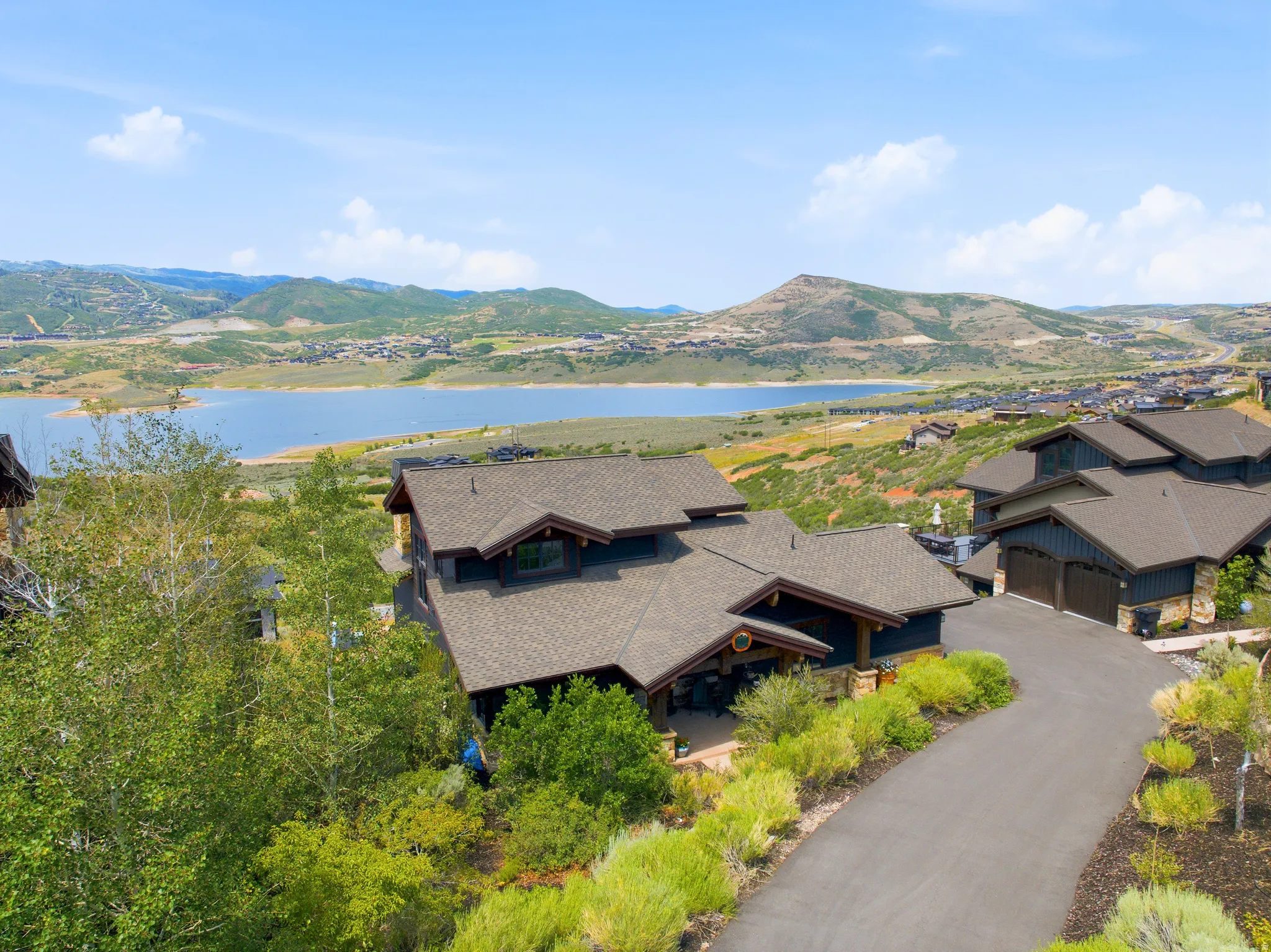 Contemporary dark-toned exterior with multi-gabled roofs and stone accents