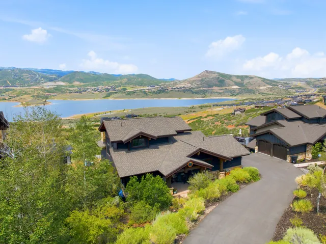 Contemporary dark-toned exterior with multi-gabled roofs and stone accents