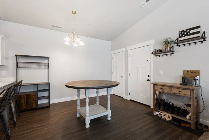 Open concept interior featuring dark wood-finish flooring