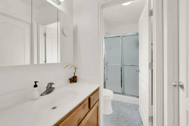 Primary Bathroom with beautiful new tile floors.