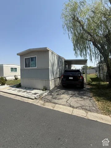 Light gray siding exterior with white trim