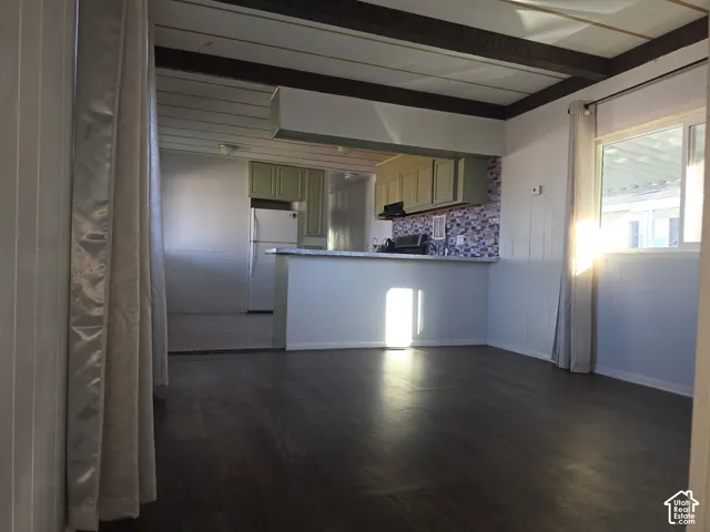 Dark wood-finish flooring with light-toned wall paneling