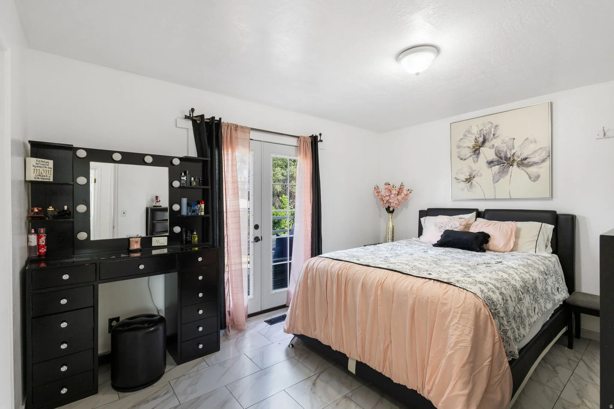 White walls and grey tile flooring create a bright atmosphere