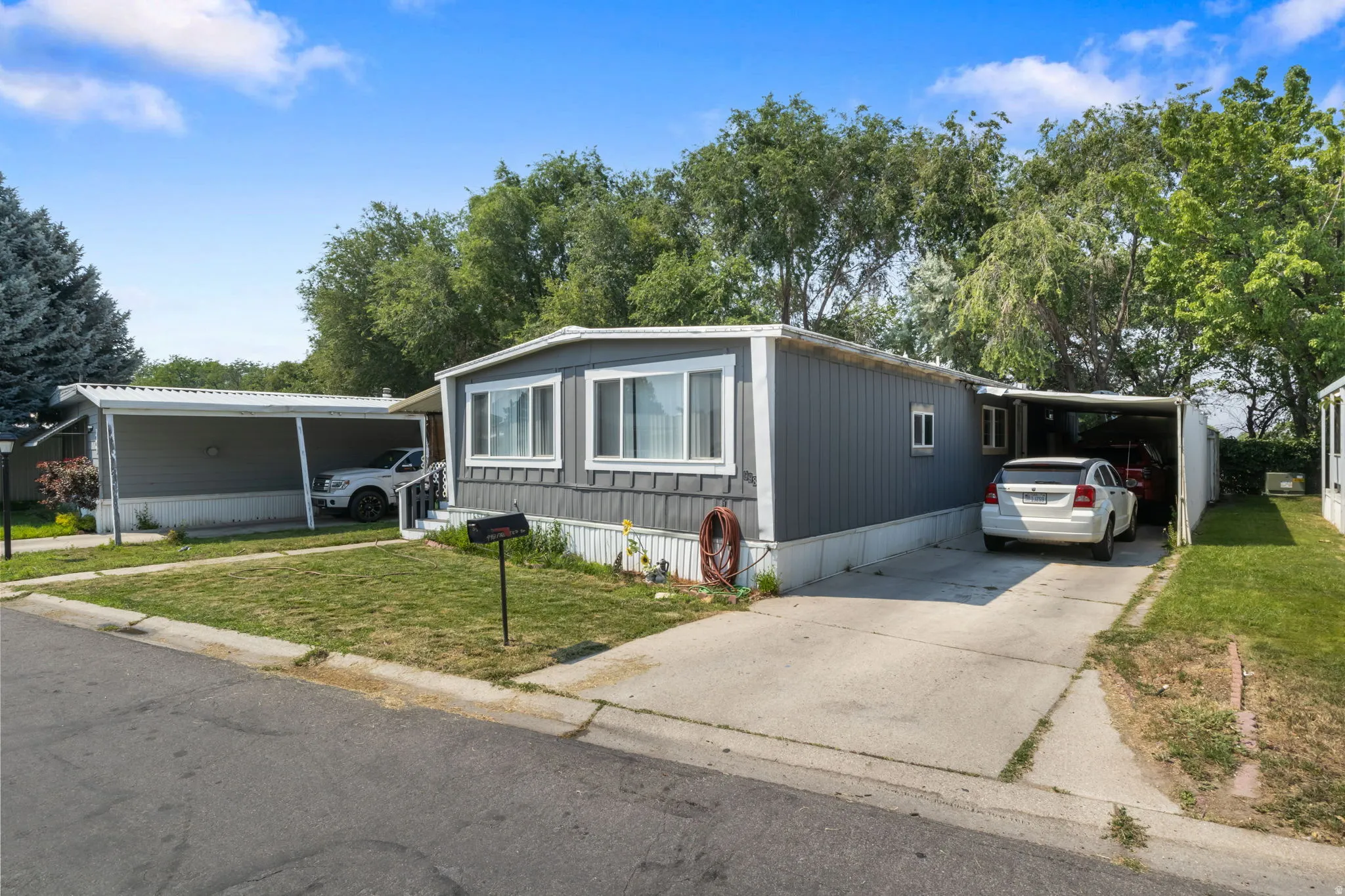 Property exterior featuring gray horizontal siding and white trim